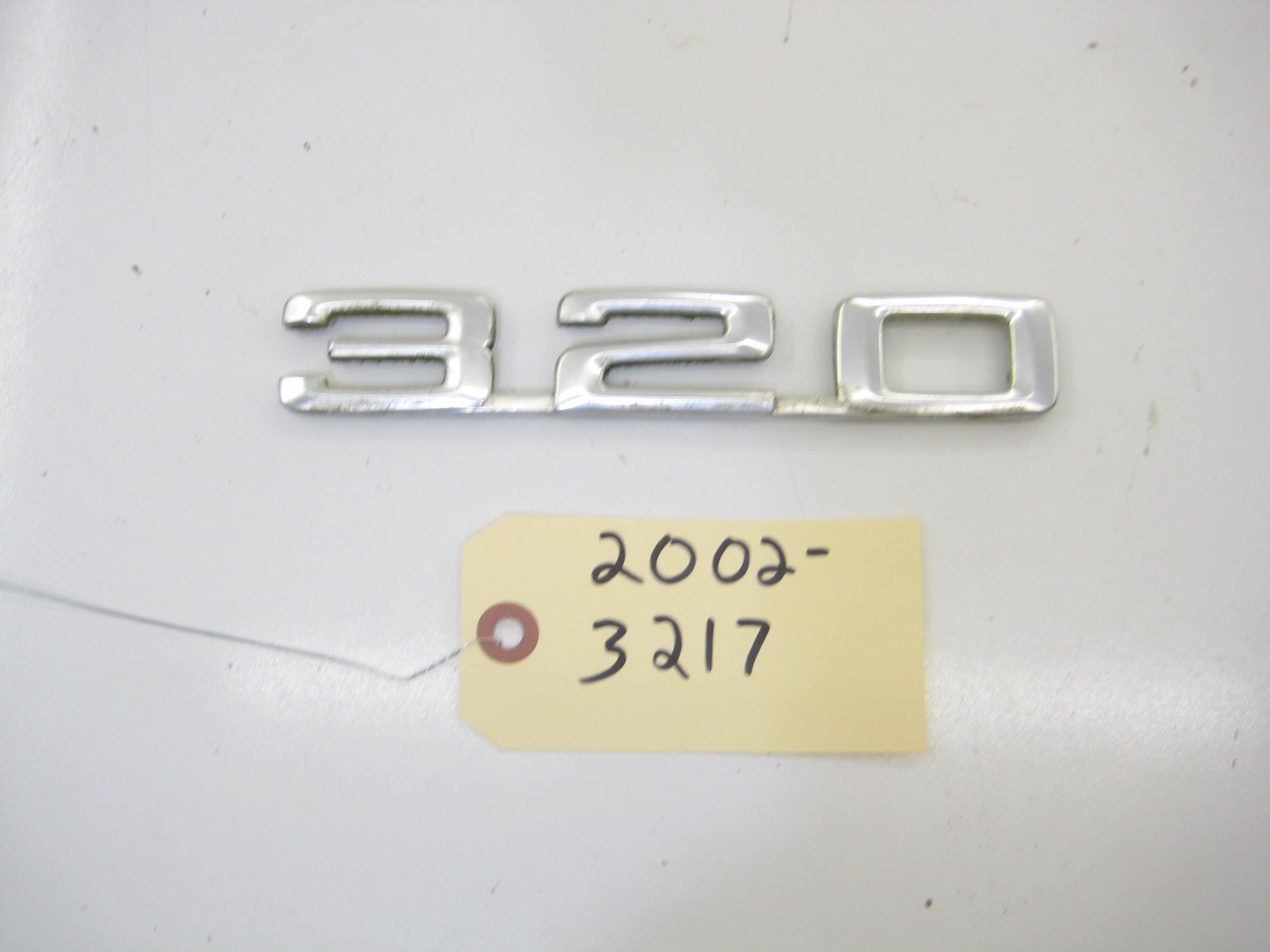 320 Trunk Script Emblem