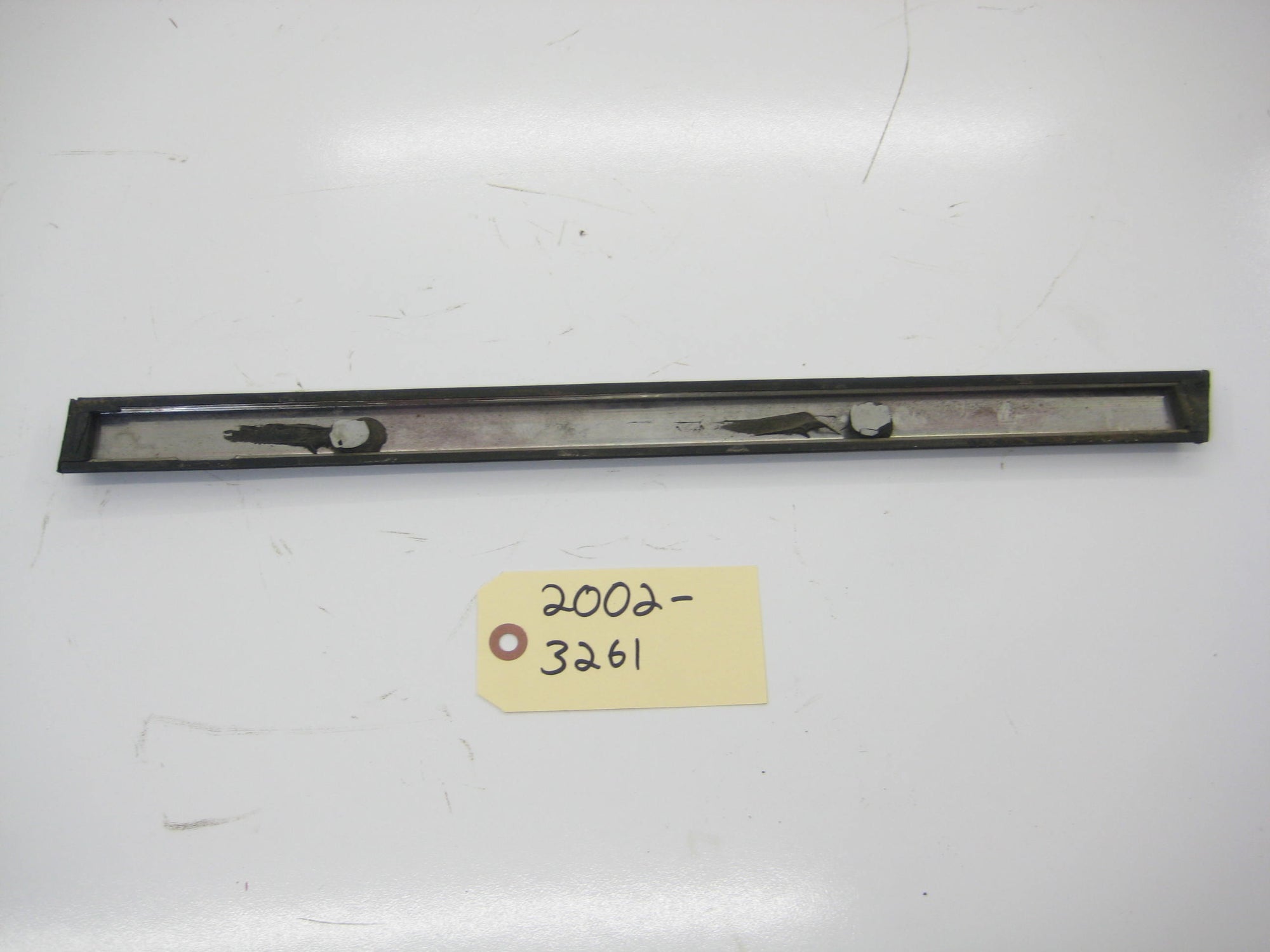 Right Passenger Rear Quarter Bump Trim In Front Of Tire