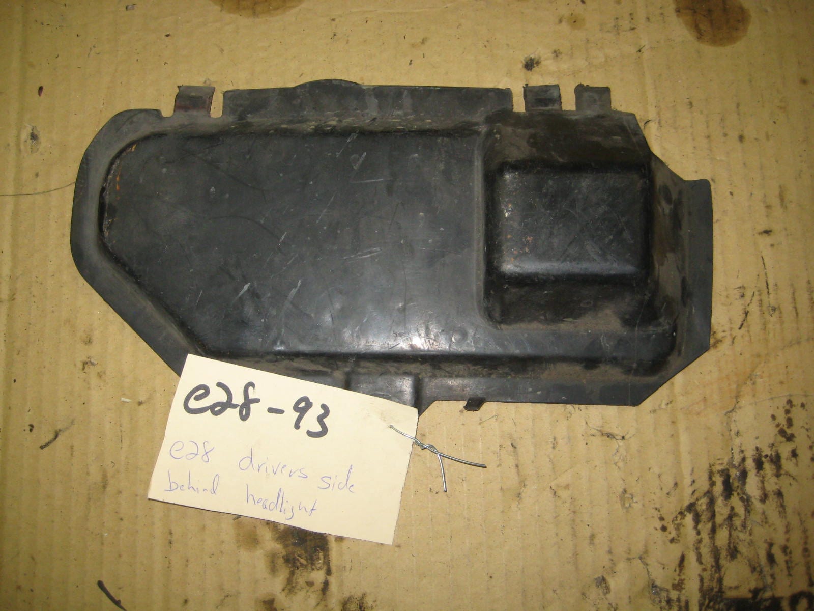 e28 drivers side panel behind headlight